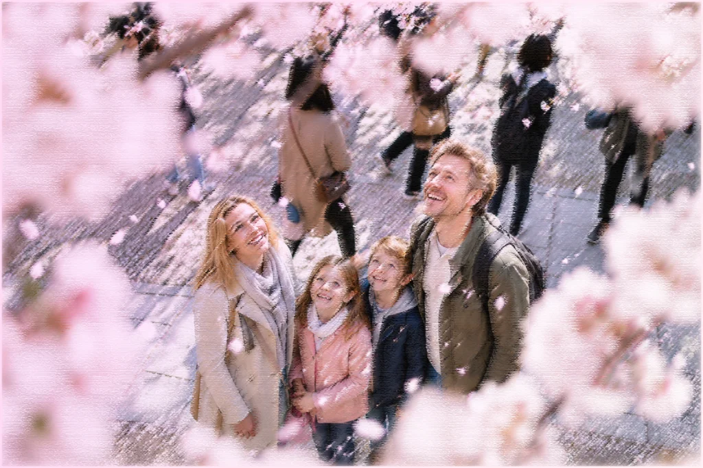 桜を見上げる外国の家族
